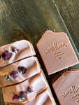 Pink soaps with rose buds on top