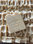 Image shows a close up of soap tops and a single soap.