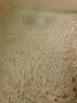 Photo shows bubbly bath water.
