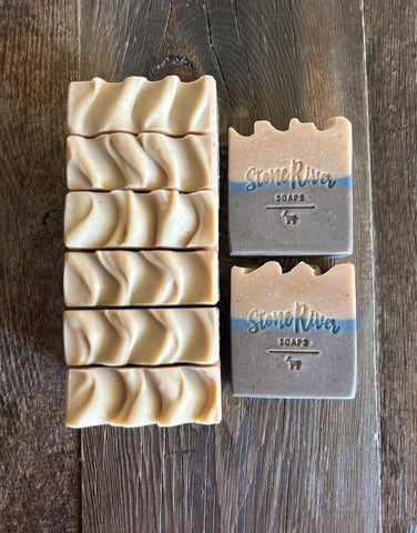 Image shows tan, blue and brown soaps.