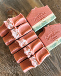 Image shows a group of soap designed to resemble watermelon. Topped with sea salts.