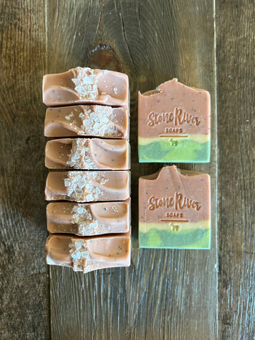 Image shows a group of watermelon designed soaps with sea salts on top