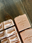 Image shows group of light pink soaps