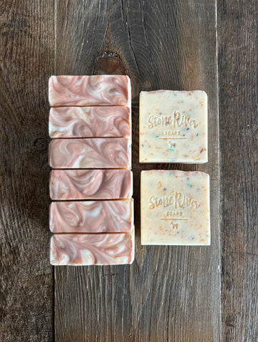 Image shows a group of white speckled soap with a light pink top.