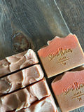 Group of tan and orange soaps.